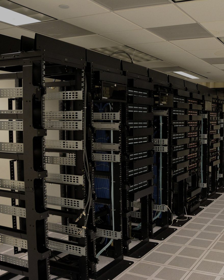 A row of server racks in a data center aisle.
